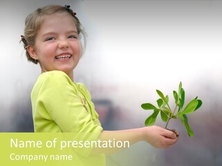 A Little Girl Holding A Plant With A Smile On Her Face PowerPoint Template