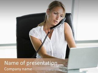 Businesswoman Sitting In Office With Laptop On Telephone PowerPoint Template