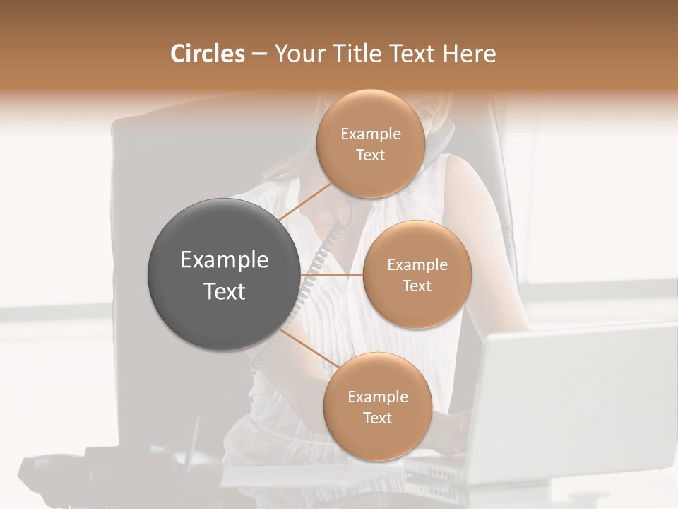 Businesswoman Sitting In Office With Laptop On Telephone PowerPoint Template