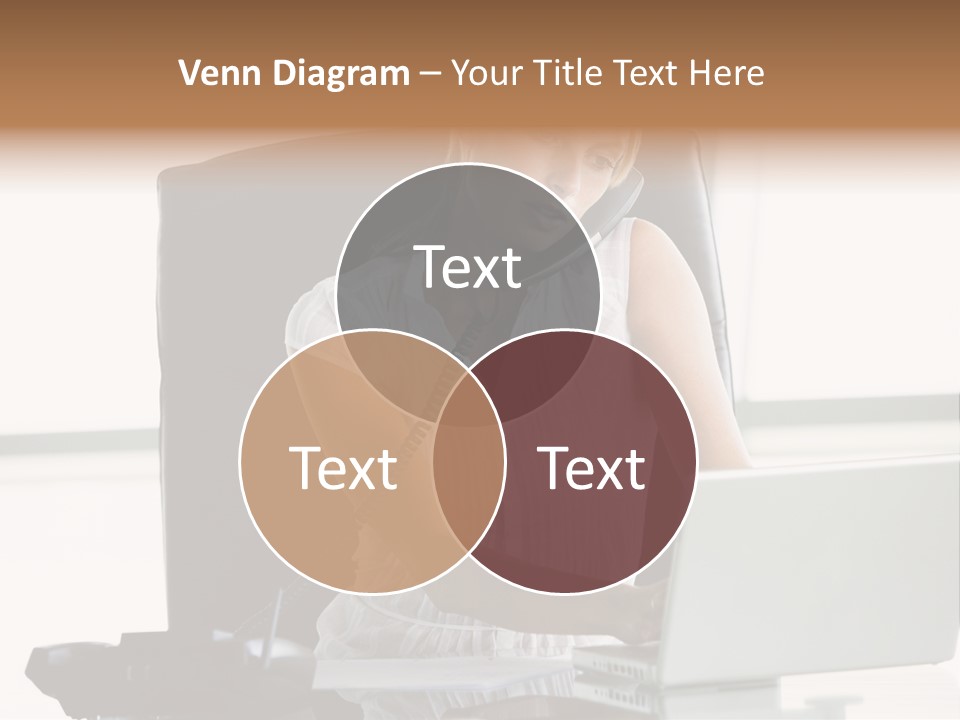 Businesswoman Sitting In Office With Laptop On Telephone PowerPoint Template