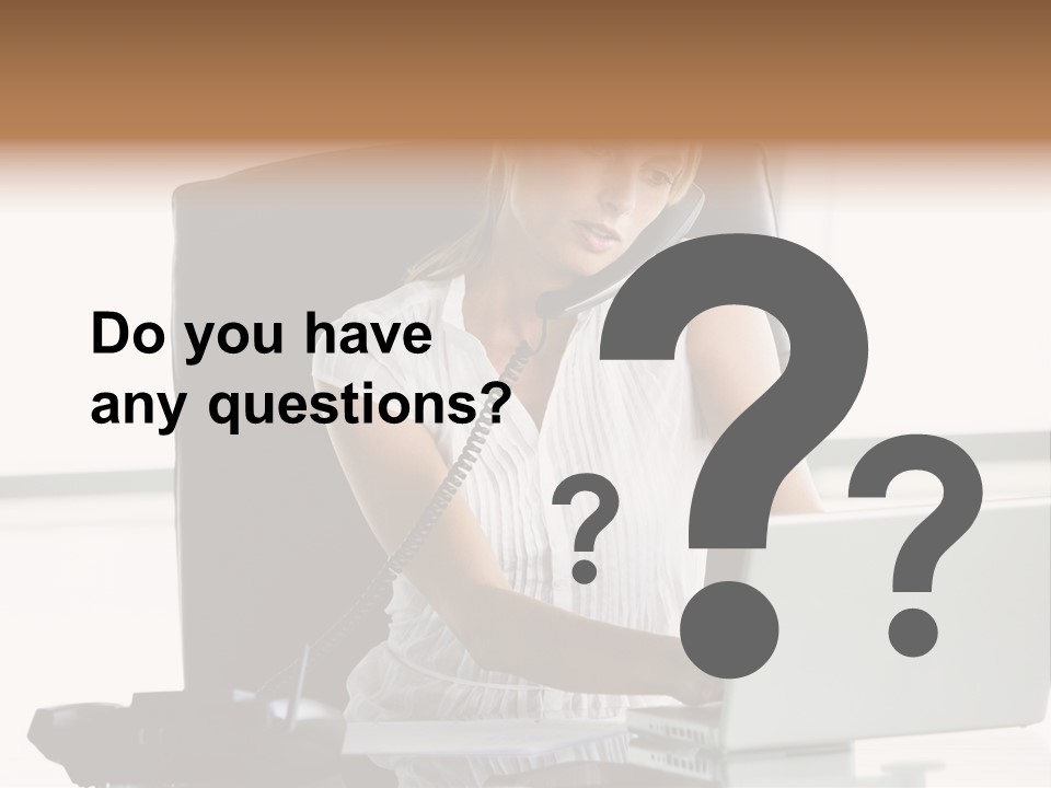 Businesswoman Sitting In Office With Laptop On Telephone PowerPoint Template