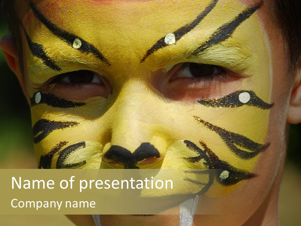 Close-Up Of Child Painted In The Face As A Tiger PowerPoint Template