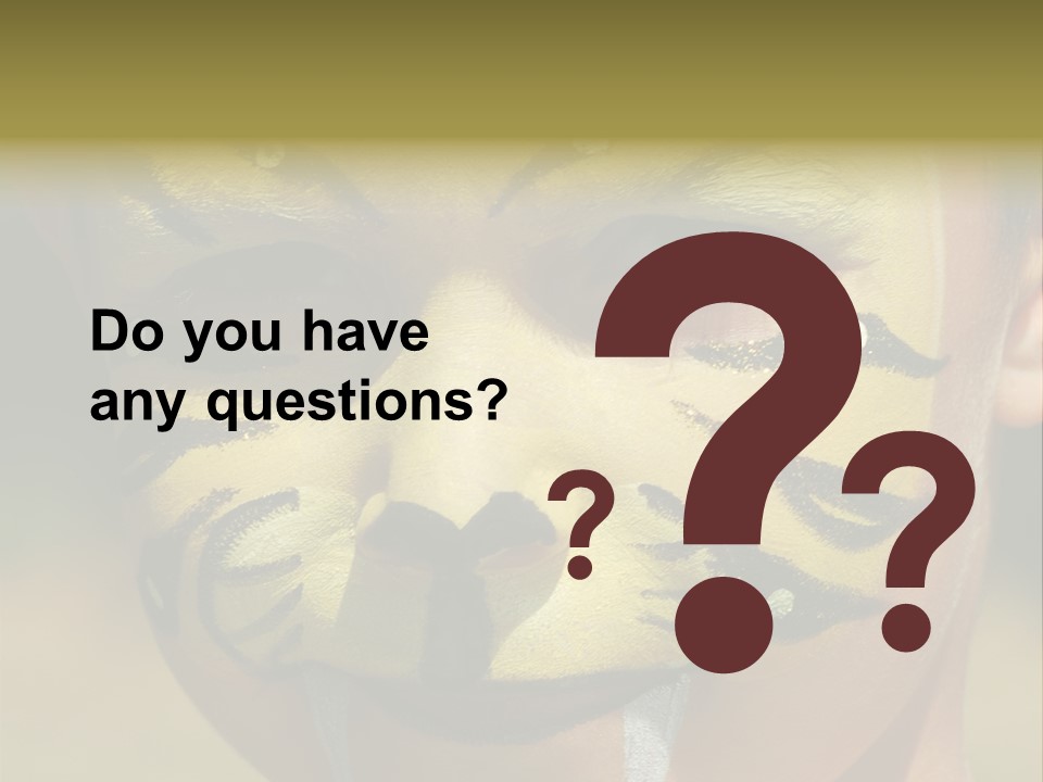 Close-Up Of Child Painted In The Face As A Tiger PowerPoint Template