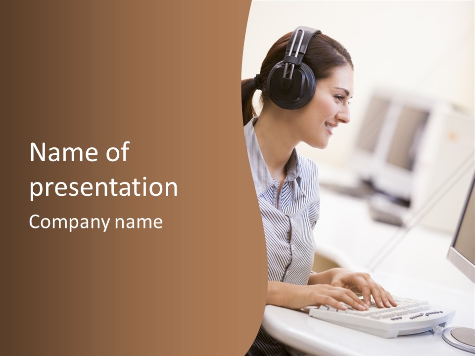 Woman Wearing Headphones In Computer Room Typing And Smiling PowerPoint Template