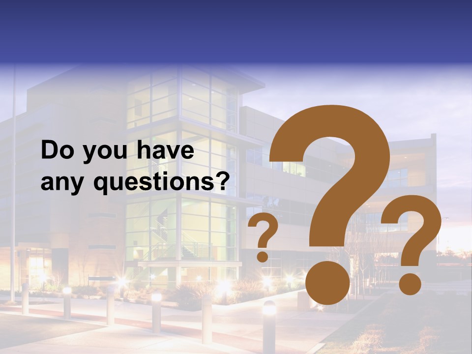 An Office Building With A Empty Parking Lot PowerPoint Template