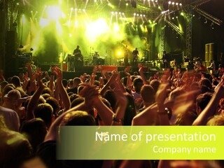 A Large Crowd Of People At A Concert PowerPoint Template