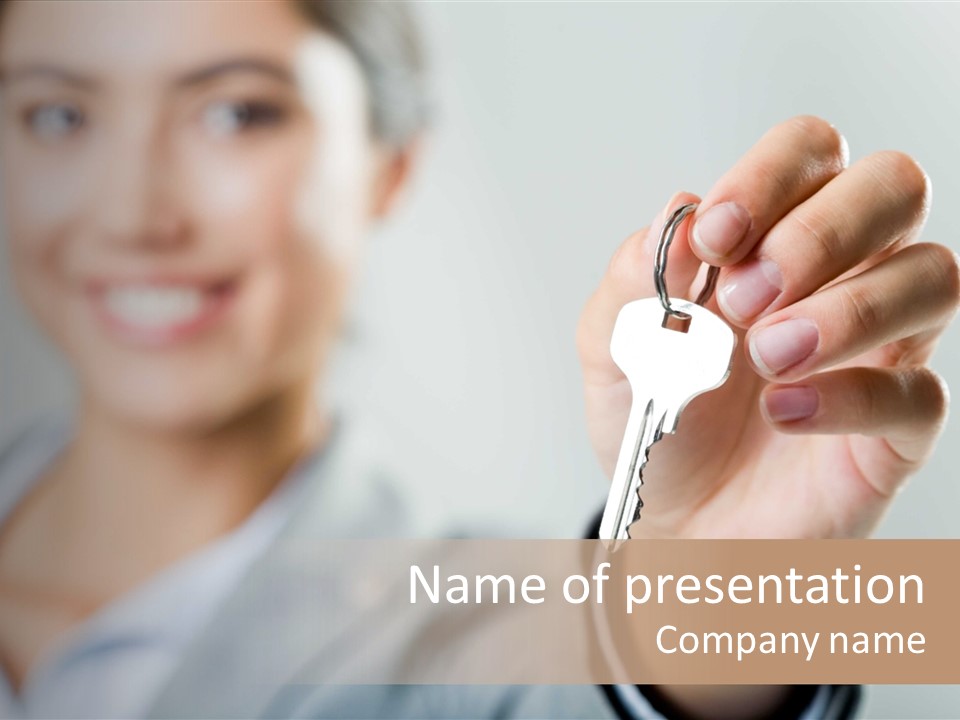 Photo Of Happy Woman├В??S Hand Holding New Key And Pointing It At Camera PowerPoint Template