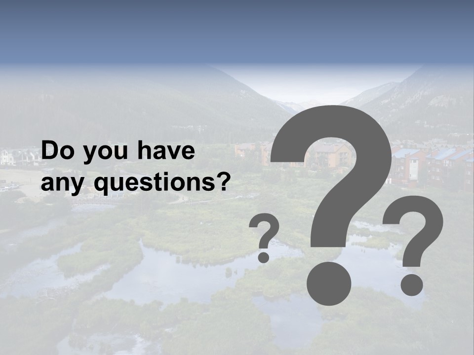 A River Running Through A Lush Green Valley PowerPoint Template