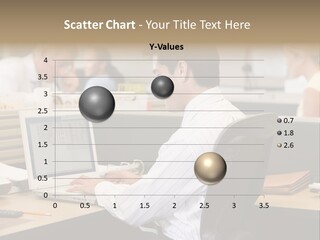 Businessman In Cubicle Using Laptop PowerPoint Template