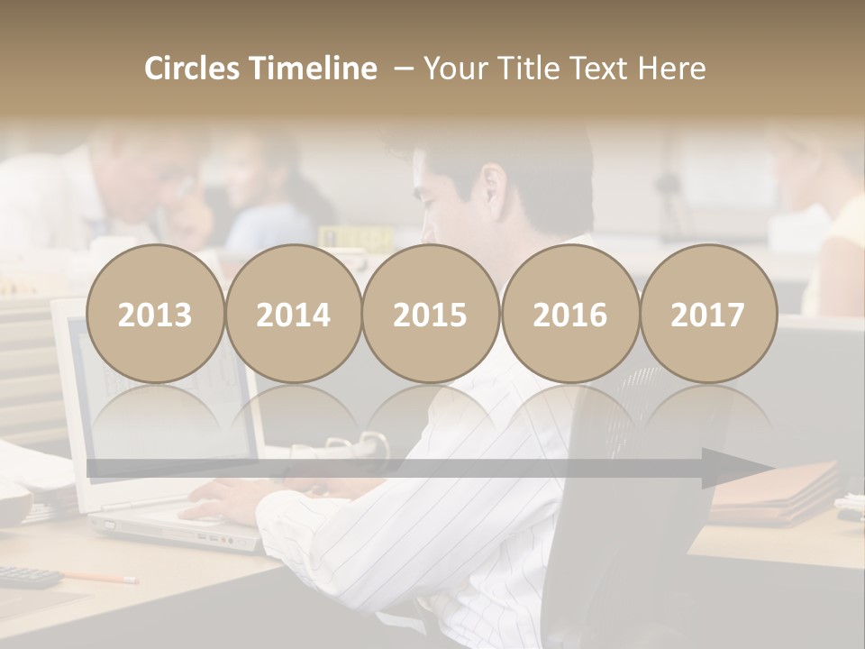 Businessman In Cubicle Using Laptop PowerPoint Template