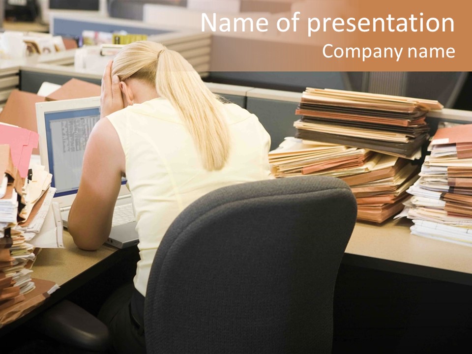 Businesswoman In Cubicle With Laptop And Stacks Of Files PowerPoint Template