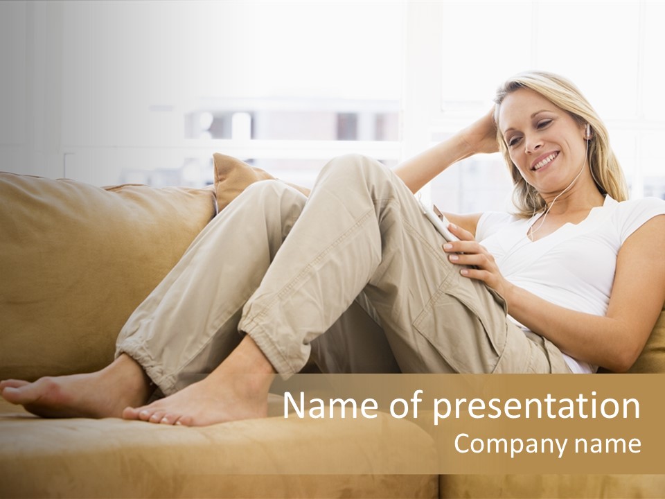 Woman In Living Room Listening To Mp3 Player Smiling PowerPoint Template