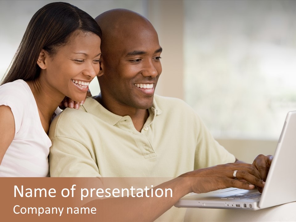 Couple In Living Room Using Laptop And Smiling PowerPoint Template