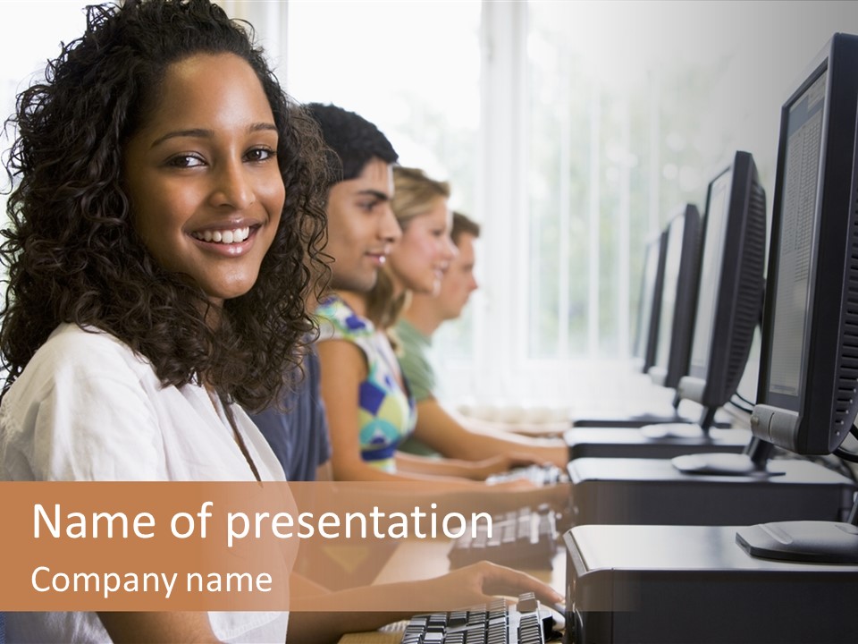 A Group Of People Sitting In Front Of Computers PowerPoint Template