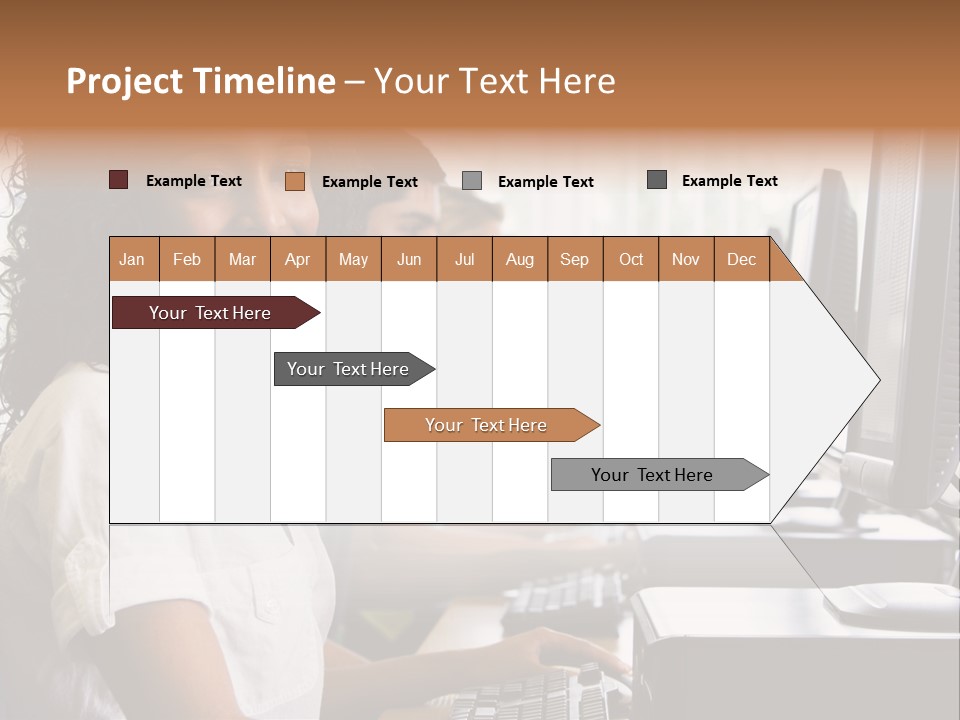 A Group Of People Sitting In Front Of Computers PowerPoint Template