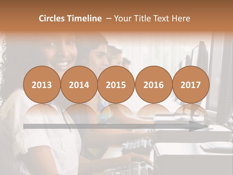 A Group Of People Sitting In Front Of Computers PowerPoint Template