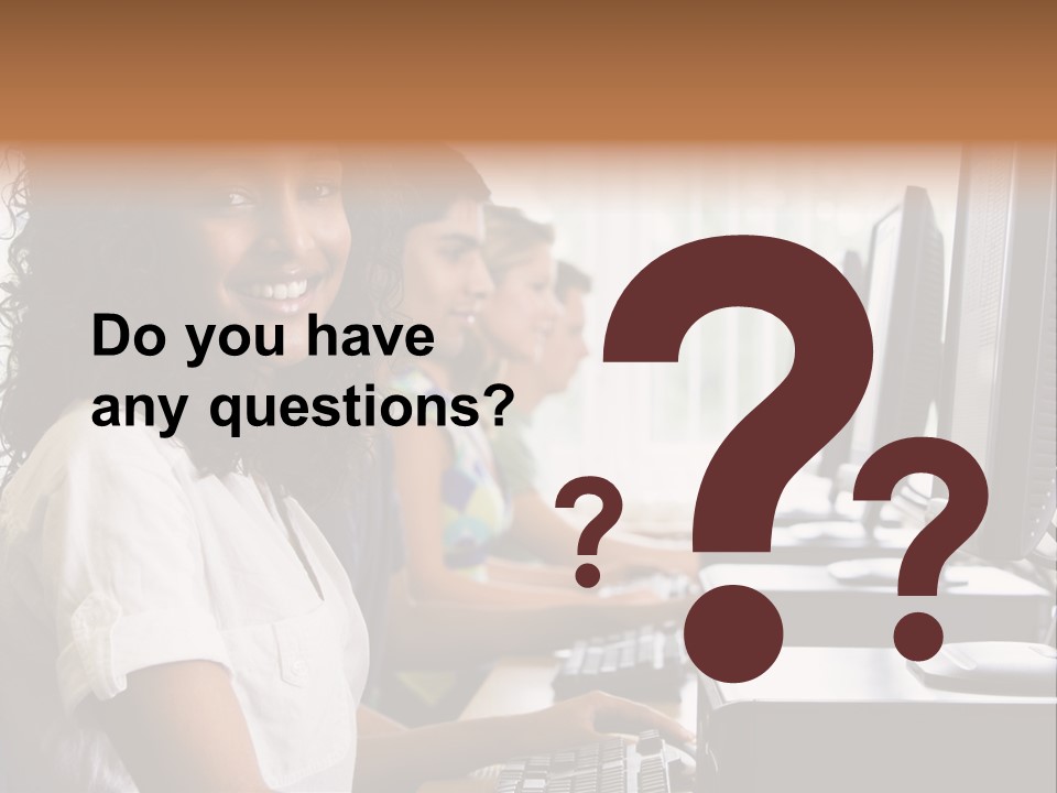 A Group Of People Sitting In Front Of Computers PowerPoint Template