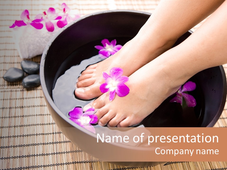 Woman Soaking Feet In Bowl Of Floral Scented Water In Spa PowerPoint Template