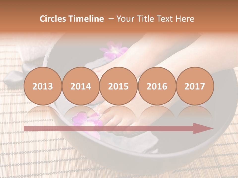 Woman Soaking Feet In Bowl Of Floral Scented Water In Spa PowerPoint Template