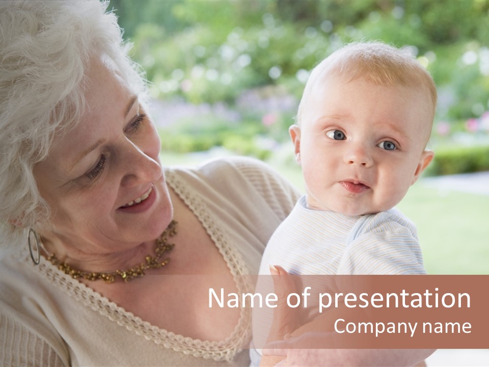 Grandmother Outdoors On Patio With Baby Smiling PowerPoint Template