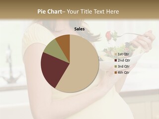 Pregnant Woman In Kitchen Eating A Salad Smiling PowerPoint Template