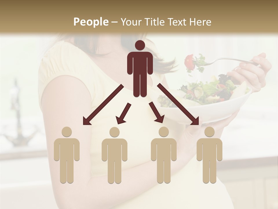 Pregnant Woman In Kitchen Eating A Salad Smiling PowerPoint Template