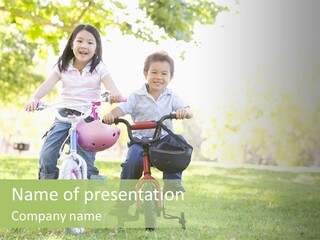 Brother And Sister Outdoors On Bicycles Smiling PowerPoint Template