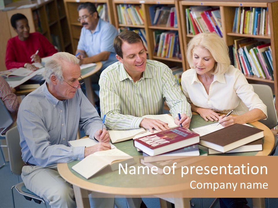 A Group Of People Sitting Around A Table With Books PowerPoint Template