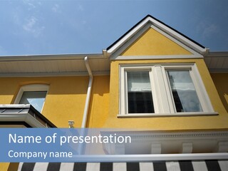 A Detail Of A Yellow Building Against A Bright Blue Sky. PowerPoint Template