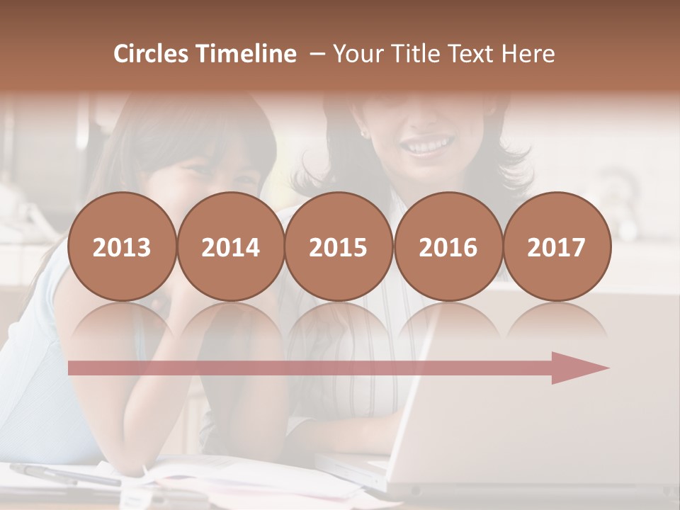 A Woman And A Girl Sitting In Front Of A Laptop Computer PowerPoint Template