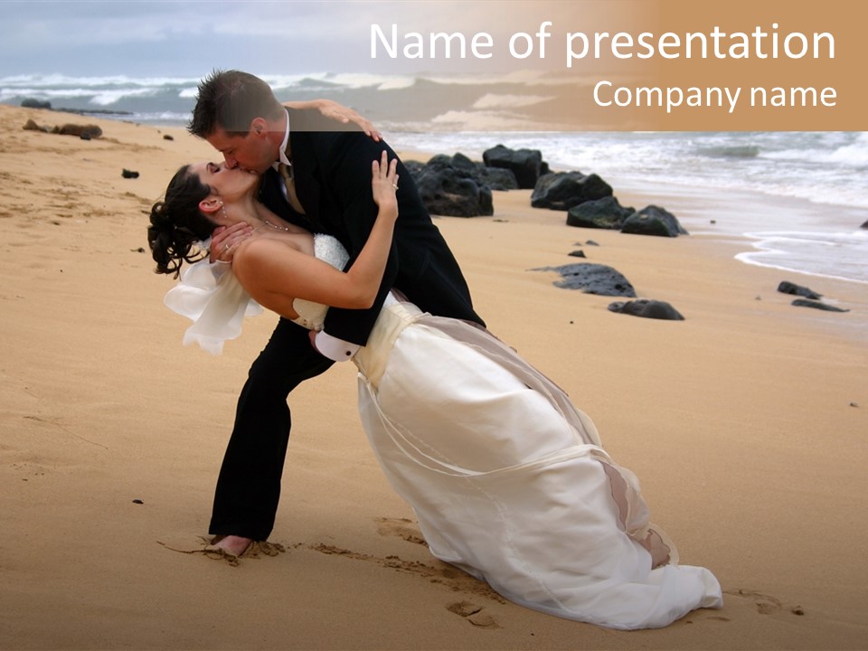 A Bride And Groom Share A Kiss On The Beach. PowerPoint Template