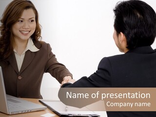 A Smiling Businesswoman Shakes Hands With A Young Businessman PowerPoint Template