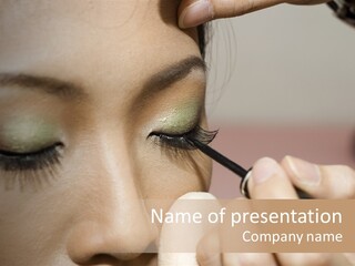 A Young Woman Applying Makeup PowerPoint Template