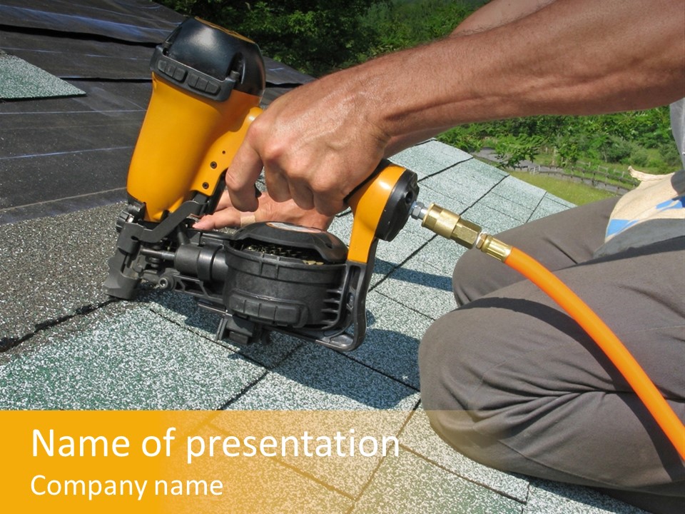 Carpenter Uses Nail Gun To Attach Asphalt Shingles To Roof PowerPoint Template