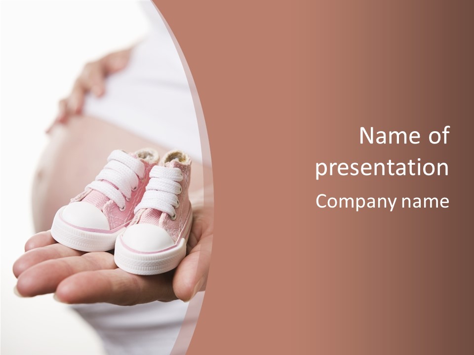 Pregnant Woman Holding Pair Of Pink Shoes For Baby Girl PowerPoint Template