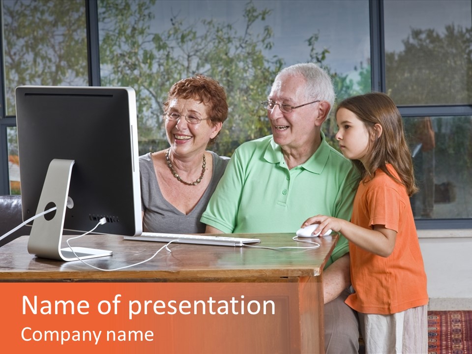 Grandparents And Granddaughter With Computer At Home PowerPoint Template