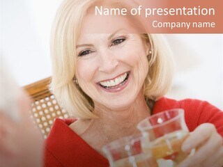 A Woman Is Smiling And Holding A Glass PowerPoint Template