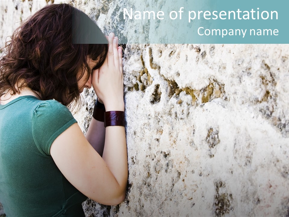 Young Female Prayer Against Stone Wall. PowerPoint Template