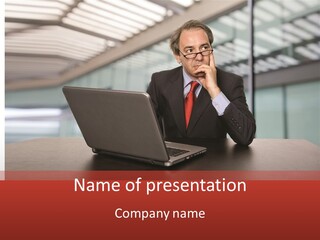 Mature Business Man Working With His Laptop PowerPoint Template