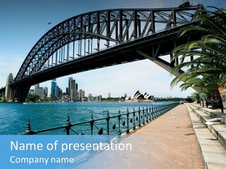 A Bridge Over A Body Of Water With A City In The Background PowerPoint Template