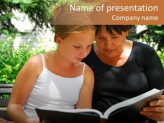 Grandmother And Granddaughter Reading A Book PowerPoint Template