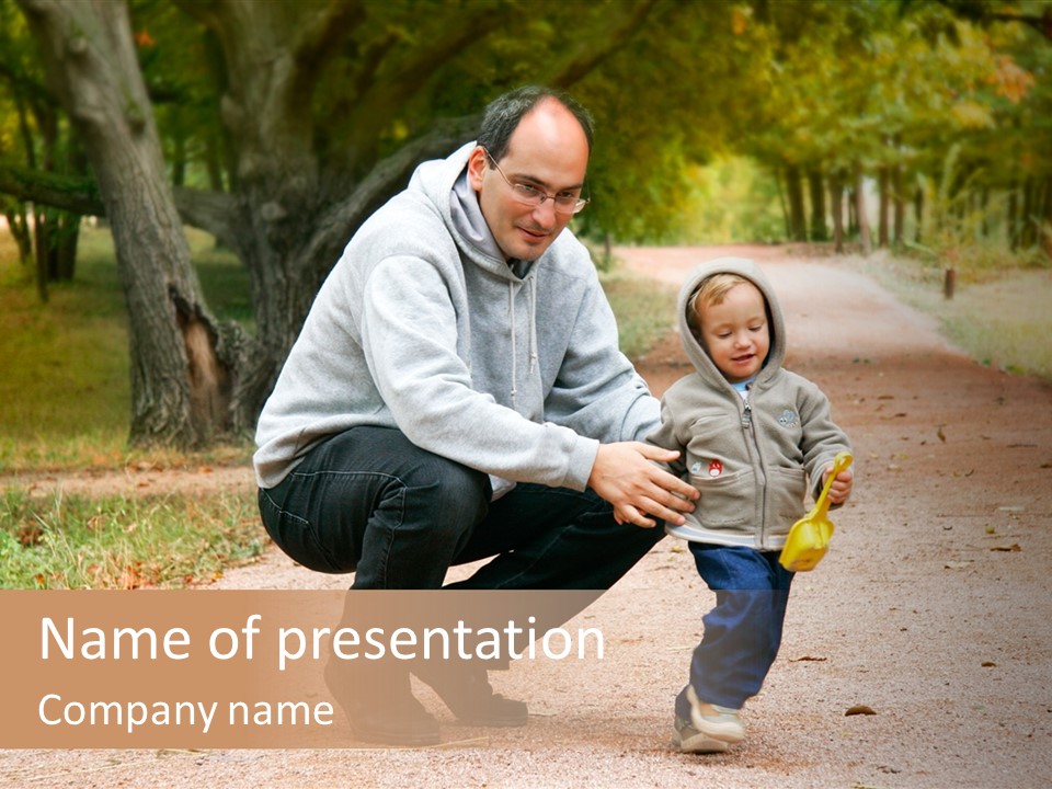 Father And Son In Autumn Park PowerPoint Template