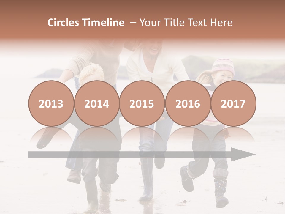 Family Running On Beach Holding Hands Smiling PowerPoint Template