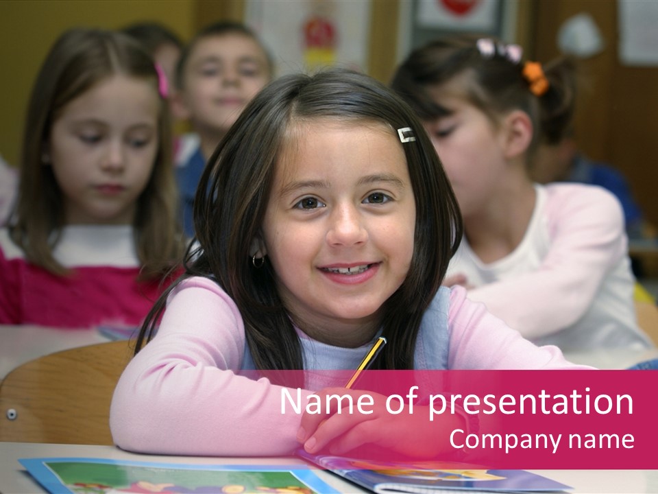 A Group Of Children Sitting At A Table In A Classroom PowerPoint Template