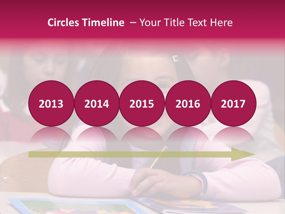 A Group Of Children Sitting At A Table In A Classroom PowerPoint Template