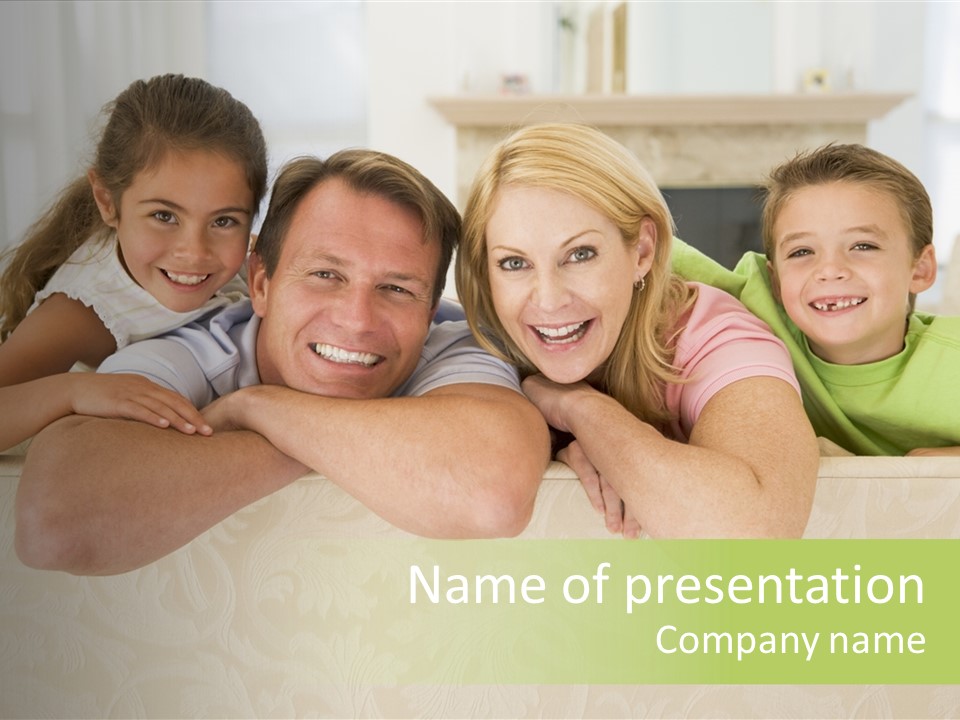 Family Sitting In Living Room Smiling PowerPoint Template