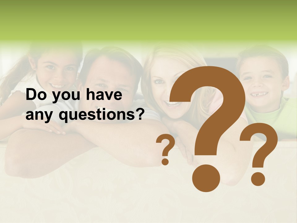 Family Sitting In Living Room Smiling PowerPoint Template