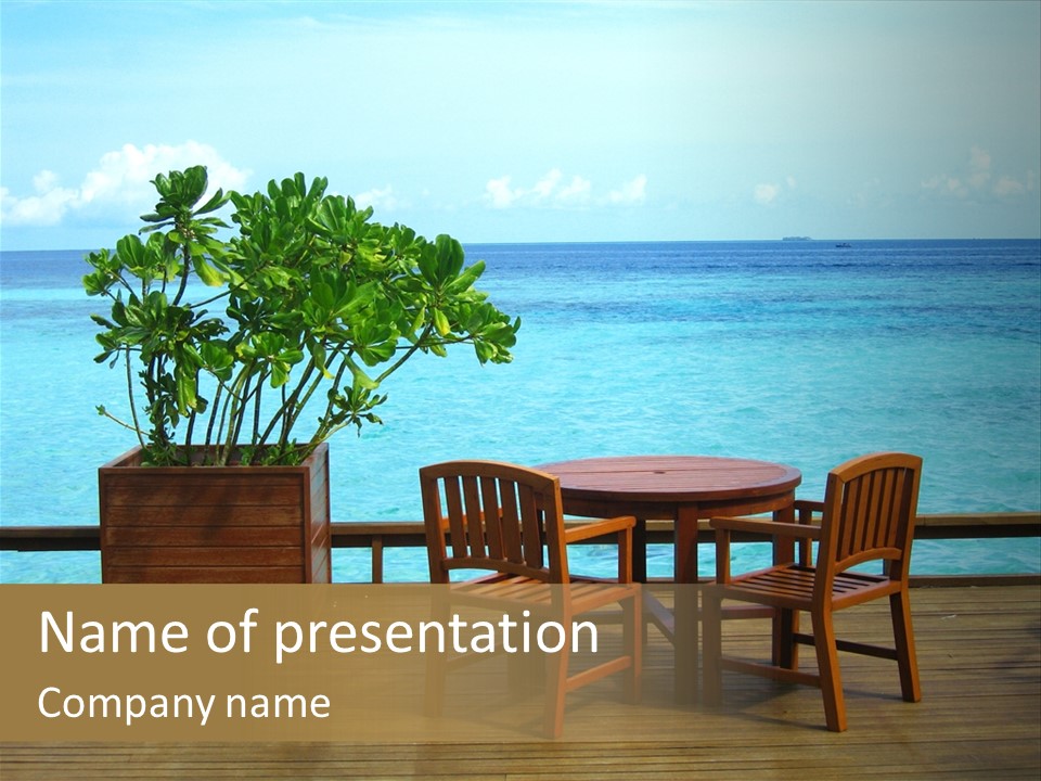 Table And Chairs At Seaside PowerPoint Template