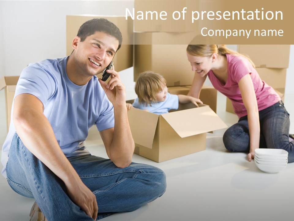 A Man Sitting On The Floor Talking On A Cell Phone PowerPoint Template