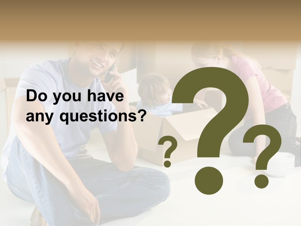 A Man Sitting On The Floor Talking On A Cell Phone PowerPoint Template